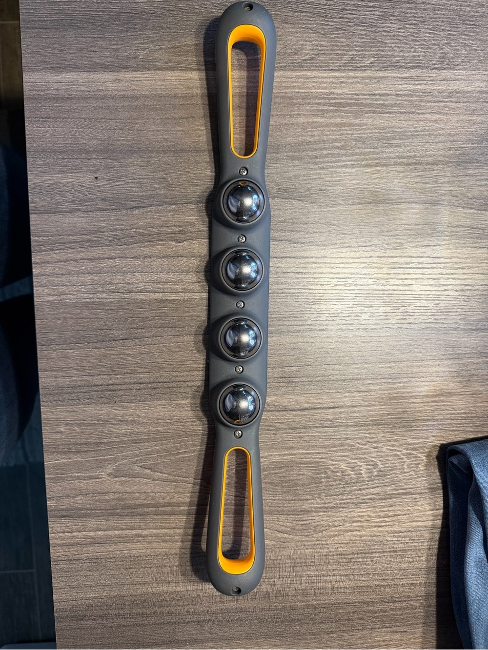 Handheld Roller Massager in Gray and Yellow